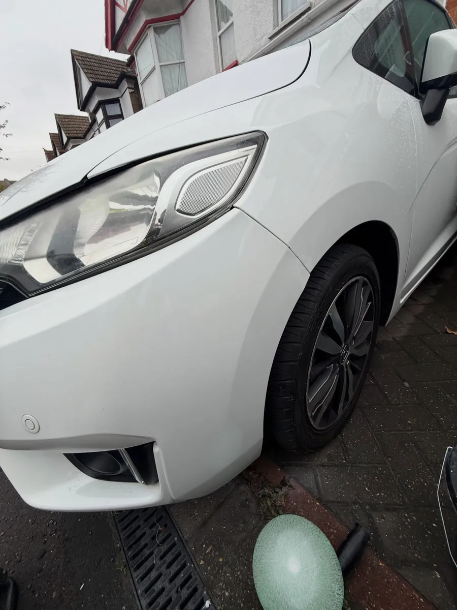 After: white hatchback front bumper